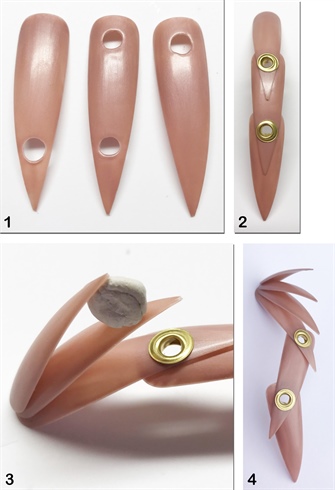 1. This particular design was inspired by Marian Newman. Using 3 medium stiletto tips, create holes with an electric file to insert metal eyelets. 2. Secure the tips to each other using the eyelet system. 3. Add some additional layering by placing 2 slightly smaller tips on top of the base tip. These are secured into place with Clear Polymer and positioned while polymerizing with Blue Tack. 4. This tip offers some layering and movement/flexibility.