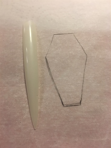 1) Sketch out the outline for your coffin shape on wax paper.