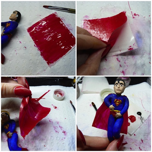 I created Superman's cape using a layer of red gel and the backing paper of a nail form then attached it with a little clear gel.