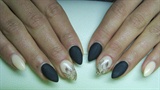 Soft orange and black matte nails