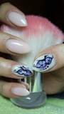 Pink nails with butterfly