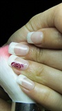 French manicure with red rose