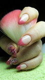 Pink french manicure with a flower