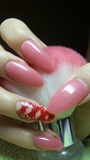 Pink nails with red ribbons