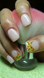 Nails with orange, yellow and green dots