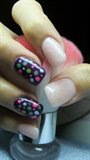 Gently pink and purple nails with dots
