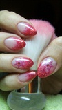Red nails with glitter and snowflakes