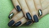 Matte black and gold nails