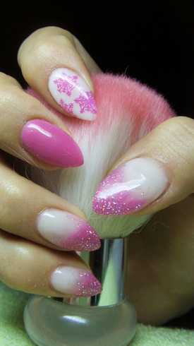 Pink and white nails with snowflakes