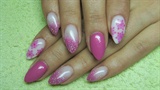 Pink and white nails with snowflakes