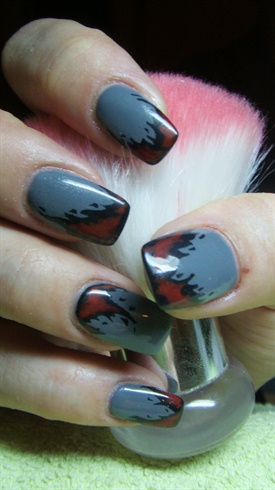 Grey nails with black and red flames