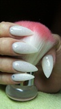 White stiletto nails with glitter