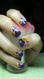 Purple nails with yellow roses