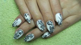 White nails with black roses