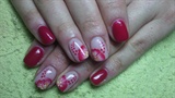 Red nails with a flower
