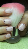 Short powder pink nails with glitter