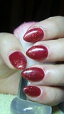Red nails with glitter