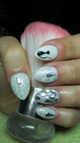 White nails with a cat and rhinestones