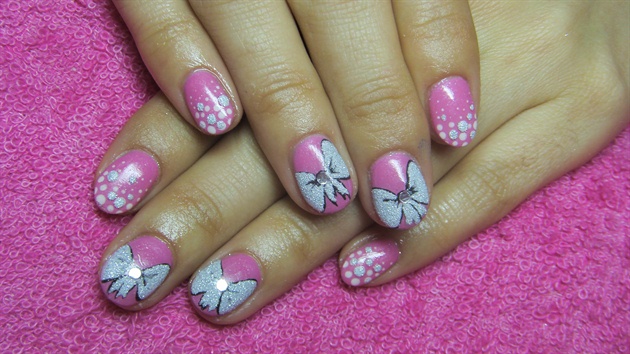 Pink nails with bows and polka dots