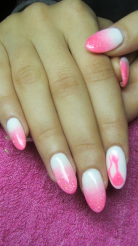 Pink and white ombre nails with a cat