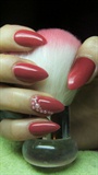 Red nails with pearls