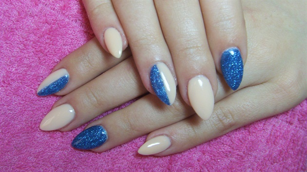 Nude nails with blue glitter