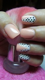 Pastel pink and white nails with dots