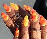 Burnt orange And yellow Acrylic Nails