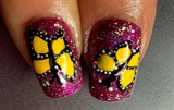 Yellow butterflys on purple shimmer nail