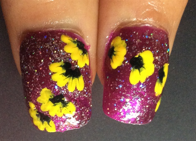 Yellow flowers on purple shimmer nails