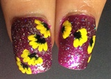 Yellow flowers on purple shimmer nails