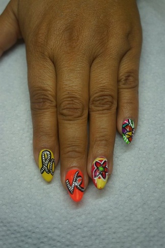 With a striper, and different colors of polish create different shapes on the pinky nail and add black lines.